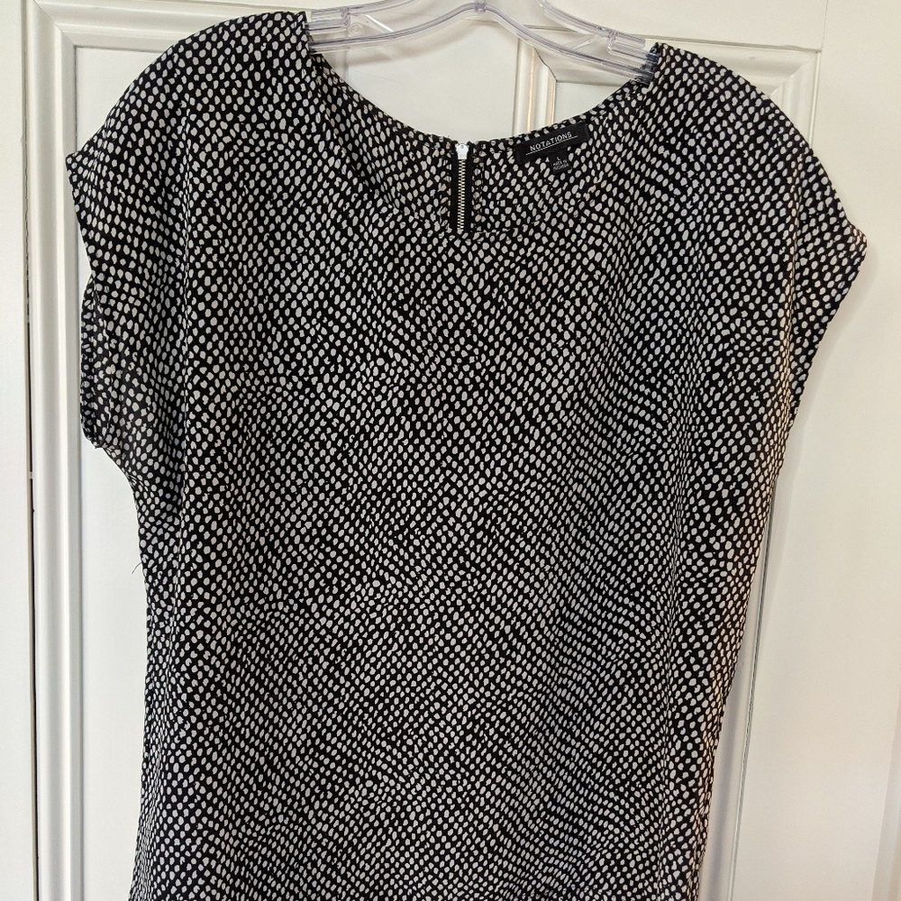 Black hi-lo blouse with white polkdots